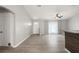 Spacious living room with neutral walls and light wood-style flooring at 4565 Eldron Ave, North Port, FL 34286