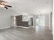 Open-concept living room with neutral tones, new floors, and lots of natural light at 4565 Eldron Ave, North Port, FL 34286