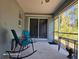 Relaxing screened porch featuring comfortable seating and view of the outdoors at 4565 Eldron Ave, North Port, FL 34286