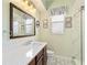 Bathroom featuring a modern vanity, decorative mirror and shower at 4958 Gardiners Bay Cir, Sarasota, FL 34238