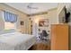 Bedroom with a desk, comfortable bed, and a ceiling fan at 4958 Gardiners Bay Cir, Sarasota, FL 34238