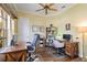 Functional home office with built-in desk, shelving, and a cozy atmosphere, ideal for remote work and study at 4958 Gardiners Bay Cir, Sarasota, FL 34238