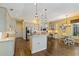 A well-lit kitchen featuring granite countertops, stainless steel appliances, and a breakfast bar at 4958 Gardiners Bay Cir, Sarasota, FL 34238