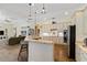 Spacious kitchen with stainless appliances, stylish cabinetry, and a breakfast bar, perfect for modern living at 4958 Gardiners Bay Cir, Sarasota, FL 34238