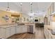 Modern kitchen featuring granite countertops, stainless steel appliances, ample cabinetry, and an open design perfect for entertaining at 4958 Gardiners Bay Cir, Sarasota, FL 34238