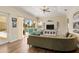Living room featuring hardwood floors, comfortable seating, and expansive windows offering beautiful views at 4958 Gardiners Bay Cir, Sarasota, FL 34238