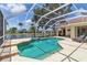 Backyard pool with beautiful lake views in a screened-in patio at 4958 Gardiners Bay Cir, Sarasota, FL 34238