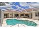 Inviting screened-in pool area with comfortable seating, perfect for outdoor relaxation and entertaining in the Florida sunshine at 4958 Gardiners Bay Cir, Sarasota, FL 34238