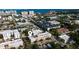 An aerial view shows the proximity to the water, a red car, and the location marker for the listing at 525 N Orange Ave # 302, Sarasota, FL 34236