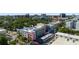 This drone view from the air features the building and surrounding cityscape at 525 N Orange Ave # 302, Sarasota, FL 34236