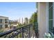 Balcony with wrought iron railing offering cityscape views and lush greenery at 525 N Orange Ave # 302, Sarasota, FL 34236