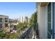 Balcony with wrought iron railing offering cityscape views and lush greenery at 525 N Orange Ave # 302, Sarasota, FL 34236