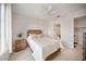 Bright bedroom features a queen bed, stylish decor, and an en-suite bathroom at 525 N Orange Ave # 302, Sarasota, FL 34236