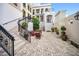 Charming courtyard with brick pavers, wrought iron accents, and outdoor seating creates a tranquil space at 525 N Orange Ave # 302, Sarasota, FL 34236