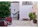 Courtyard featuring a large tree, brick pavers, and red cushioned seating at 525 N Orange Ave # 302, Sarasota, FL 34236