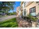 Row of colorful townhouses with wrought iron balconies and a tree-lined street offer charm and curb appeal at 525 N Orange Ave # 302, Sarasota, FL 34236