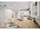 Bright kitchen featuring granite countertops, stainless steel appliances and white cabinets at 525 N Orange Ave # 302, Sarasota, FL 34236