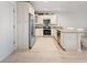 Bright kitchen featuring stainless steel appliances, white cabinets, and granite countertops at 525 N Orange Ave # 302, Sarasota, FL 34236