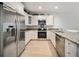 Bright kitchen featuring stainless steel appliances, white cabinets, and granite countertops at 525 N Orange Ave # 302, Sarasota, FL 34236