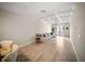 Bright living room featuring white coffered ceilings, wood floors, and French doors at 525 N Orange Ave # 302, Sarasota, FL 34236