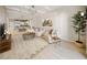 Bright, open-concept living room with coffered ceilings, hardwood floors, and a view into a modern kitchen at 525 N Orange Ave # 302, Sarasota, FL 34236