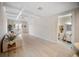Bright living room with coffered ceilings, wood floors and view of a bathroom at 525 N Orange Ave # 302, Sarasota, FL 34236