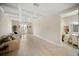 Bright living room featuring a coffered ceiling, modern lighting, and an open doorway to the bathroom at 525 N Orange Ave # 302, Sarasota, FL 34236