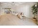 Open floorplan living room with a coffered ceiling, comfortable seating, and kitchen at 525 N Orange Ave # 302, Sarasota, FL 34236
