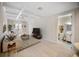 Well-lit open-concept living room with coffered ceilings, hardwood floors, and an adjacent bathroom at 525 N Orange Ave # 302, Sarasota, FL 34236