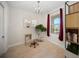 Cozy home office with a chandelier, bright natural light, desk, and outside view from the large window at 525 N Orange Ave # 302, Sarasota, FL 34236