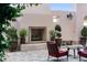 Outdoor patio with fireplace, potted plants, and comfortable seating create an inviting outdoor living space at 525 N Orange Ave # 302, Sarasota, FL 34236