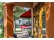 Covered outdoor patio area features outdoor seating and a red awning for shade at 525 N Orange Ave # 302, Sarasota, FL 34236