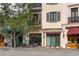 A variety of retail businesses with awnings, large windows, and detailed architecture at 525 N Orange Ave # 302, Sarasota, FL 34236