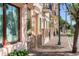 A sidewalk view displaying commercial buildings with detailed architectural trimming and brick sidewalks at 525 N Orange Ave # 302, Sarasota, FL 34236