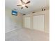 Cozy bedroom with plush carpeting, ceiling fan, and closet space for organized living at 5359 90Th Avenue E Cir, Parrish, FL 34219