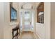 Welcoming foyer with decorative glass front door, arched transom window, and neutral color palette at 5359 90Th Avenue E Cir, Parrish, FL 34219