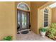 Inviting front entry with decorative glass door, tiled porch, and manicured landscaping creating curb appeal at 5359 90Th Avenue E Cir, Parrish, FL 34219