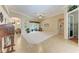 Bright living room with tile flooring, neutral walls, ceiling fan, and access to other rooms at 5359 90Th Avenue E Cir, Parrish, FL 34219