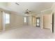 Spacious bedroom features neutral carpeting, crown molding, two windows and a ceiling fan at 5359 90Th Avenue E Cir, Parrish, FL 34219