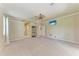 Spacious main bedroom with neutral tones, large windows, and ceiling fan providing natural light at 5359 90Th Avenue E Cir, Parrish, FL 34219