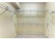 Walk-in closet with wire shelving provides ample storage space for clothing and accessories in this home at 5359 90Th Avenue E Cir, Parrish, FL 34219