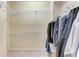 Walk-in closet with wire shelving and hanging clothes offers functional storage at 5359 90Th Avenue E Cir, Parrish, FL 34219
