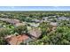 A tree-lined neighborhood is highlighted with well-maintained homes and inviting landscapes at 5584 Eastwind Dr, Sarasota, FL 34233