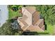 An expansive roof shows the unique architectural design and offers a bird's-eye view of the home and landscaping at 5584 Eastwind Dr, Sarasota, FL 34233