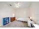 A light and airy bedroom with neutral walls, carpet, and a ceiling fan at 5584 Eastwind Dr, Sarasota, FL 34233