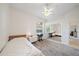 Bedroom with window, ceiling fan, and mirrored closet providing ample natural light and storage at 5584 Eastwind Dr, Sarasota, FL 34233