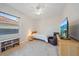 Cozy bedroom with a ceiling fan, and a bright window, complete with entertainment center at 5584 Eastwind Dr, Sarasota, FL 34233
