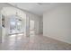 Spacious entryway with tile flooring and decorative glass double doors at 5584 Eastwind Dr, Sarasota, FL 34233