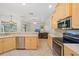 Well-lit kitchen featuring stainless steel appliances and an open layout to the living area at 5584 Eastwind Dr, Sarasota, FL 34233