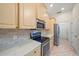 Modern kitchen features stainless steel appliances and stone countertops at 5584 Eastwind Dr, Sarasota, FL 34233